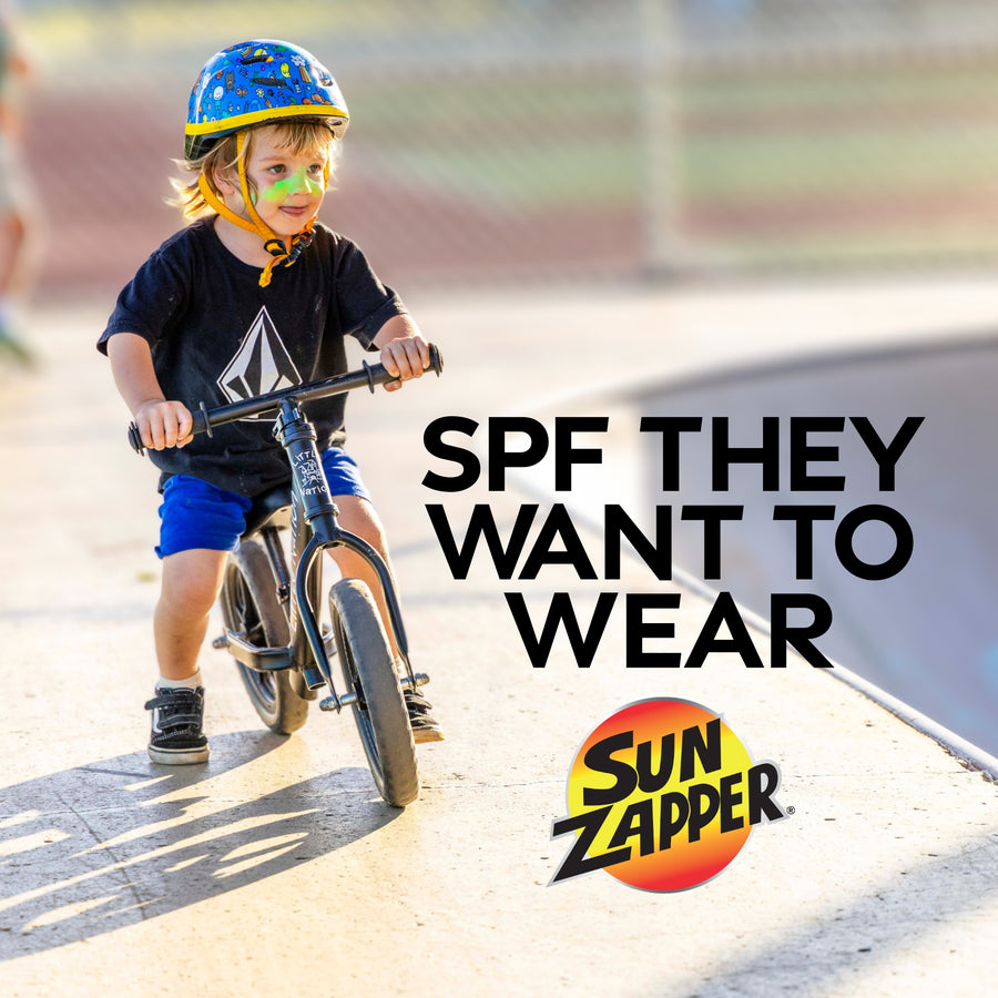 Family at the beach using Sun Zapper kids' sunscreen