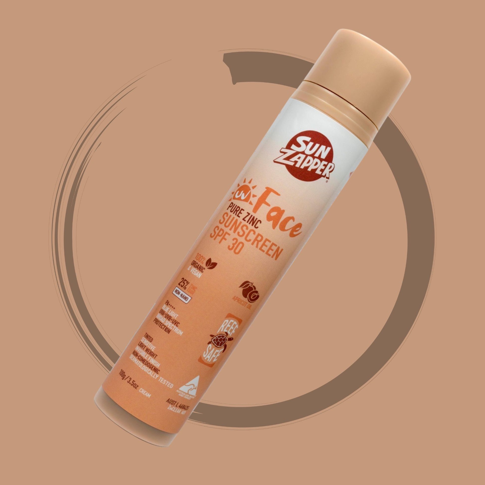 Sun Zapper Face Sunscreen spray bottle on a brown background