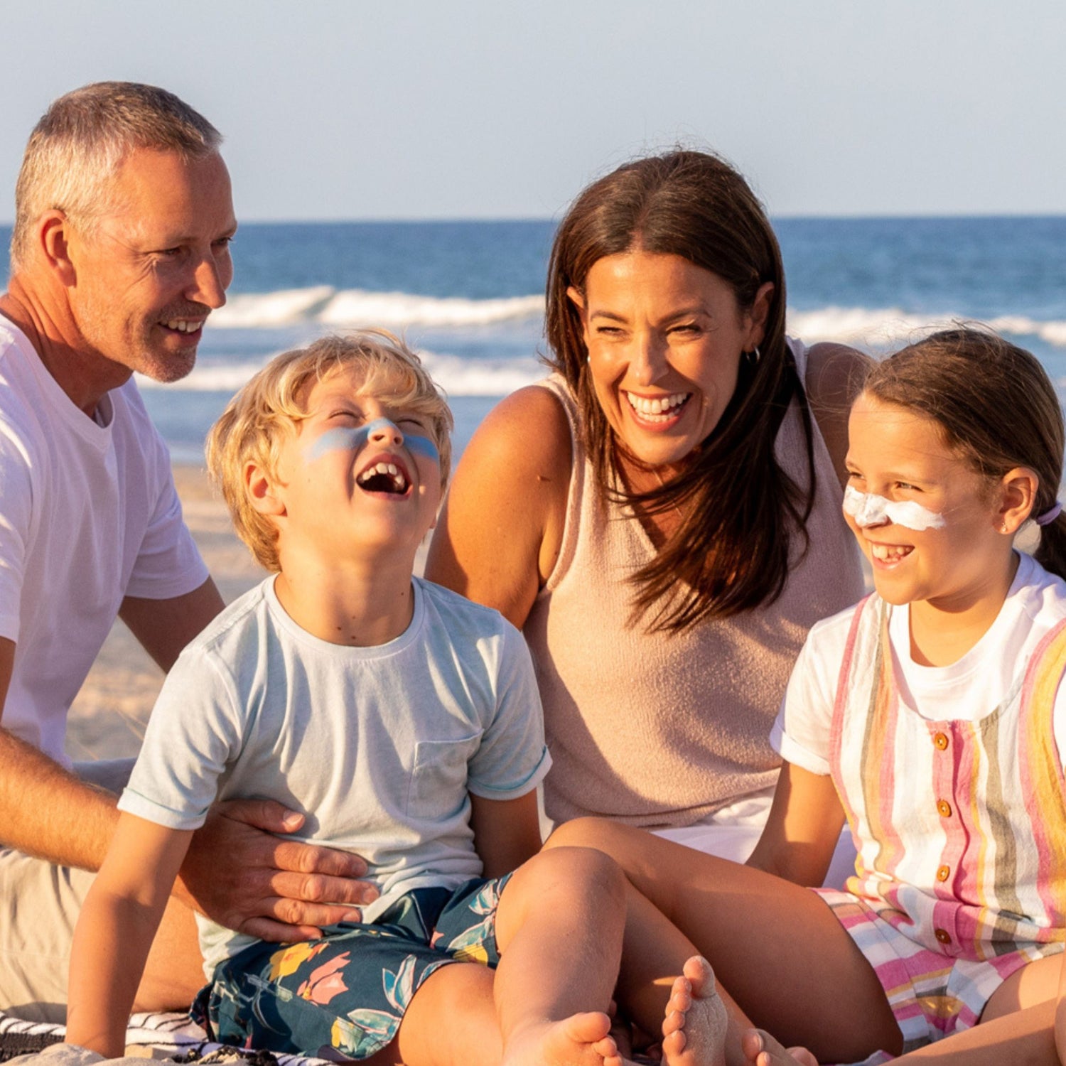 sun zapper zinc oxide sunscreen spf 50 family on beach